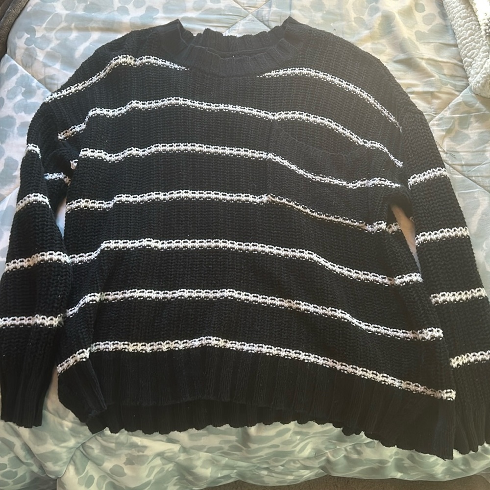 black and white knit sweater with chest pocket